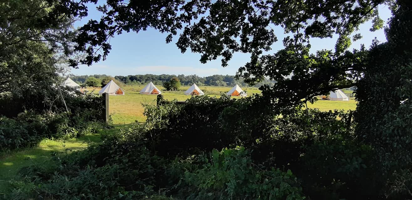 Large group of bell tents set up together